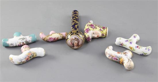 A collection of seven Dresden and Continental porcelain cane or parasol handles, late 19th / early 20th century, 6.4 - 14.8cm